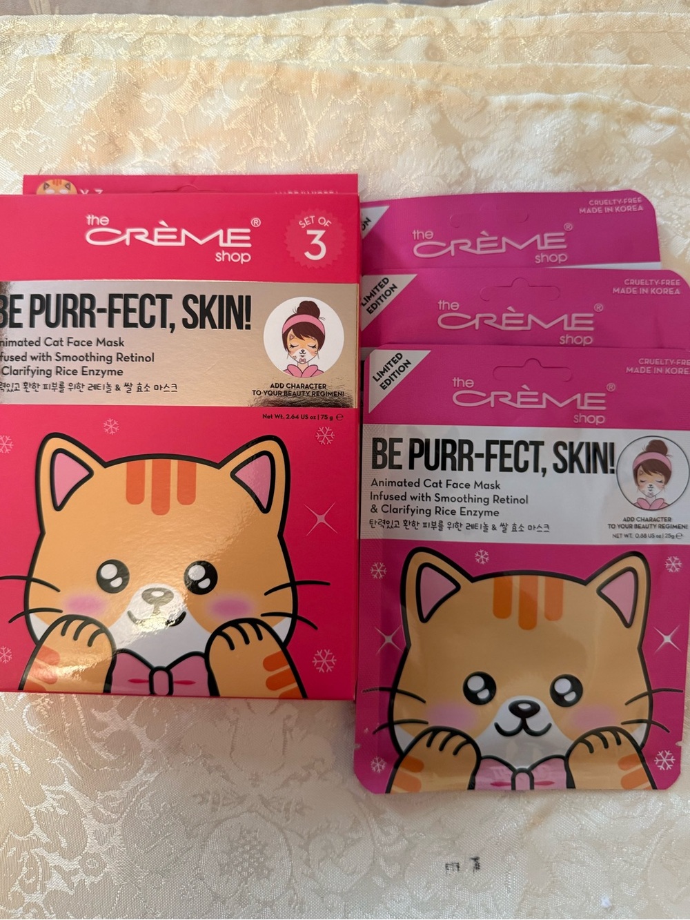 The Crème Shop "Be Purr-fect Skin!" Animated Cat Face Mask set, which cartoon